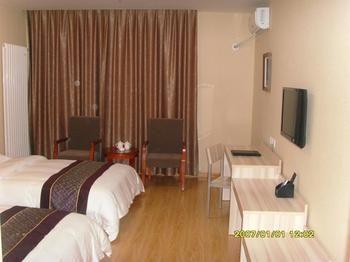 Yuangu Town Business Hotel Qingdao Bagian luar foto